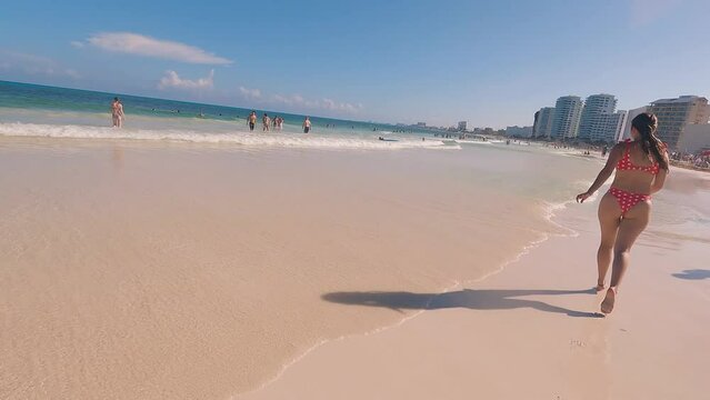 Beautiful woman enjoying the beaches of the hotel zone of Cancun