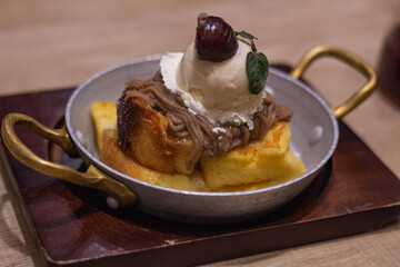 Close up of a plate of chestnut cake with vanilla ice cream in Kagoshima, Japan