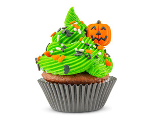 Cupcake on Halloween. Carved pumpkin. Jack o lantern. Dessert on Halloween party. Muffin decorated with colored sprinkles, candy, green frosting and Icing. Chocolate cupcake. White isolated background