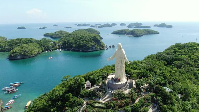 4k Aerial Drone shot of statue of Jesus Christ in pangasinan alaminos hundred islands philippines 