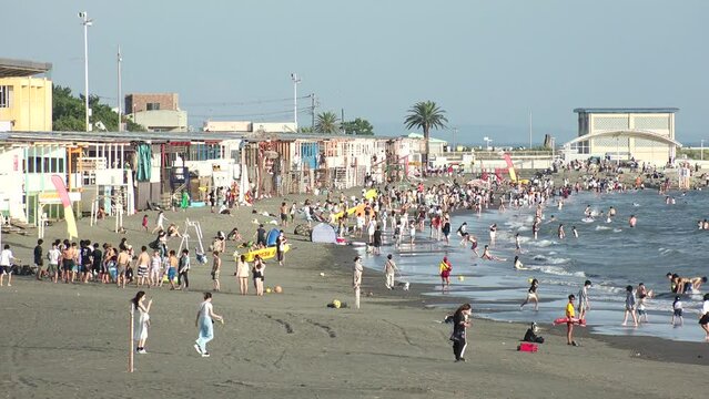 FUJISAWA, KANAGAWA, JAPAN - AUGUST 2022 : View of Enoshima beach (sea) at Shonan area in daytime. Japanese hot summer holiday (vacation) season concept video.