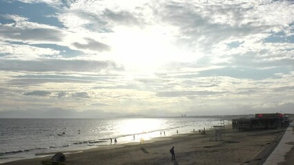 FUJISAWA, KANAGAWA, JAPAN - AUGUST 2022 : View of Enoshima beach (sea) at Shonan area in sunset. Romantic, moody sky in dusk. Japanese hot summer holiday (vacation) season concept video.