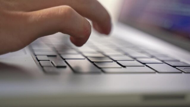 Hands delicately type out the lines needed to implement more effective network monitoring after a recent web security vulnerability was detected