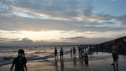 FUJISAWA, KANAGAWA, JAPAN - AUGUST 2022 : View of Enoshima beach (sea) at Shonan area in sunset. Time lapse shot, dusk to night. Japanese hot summer holiday (vacation) season concept video.