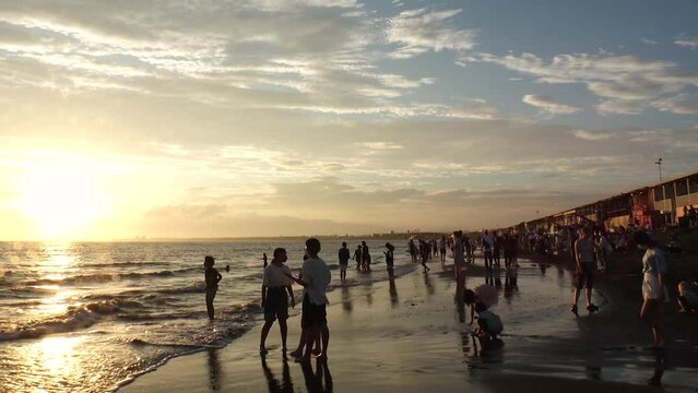 FUJISAWA, KANAGAWA, JAPAN - AUGUST 2022 : View of Enoshima beach (sea) at Shonan area in sunset. Time lapse shot, dusk to night. Japanese hot summer holiday (vacation) season concept video.