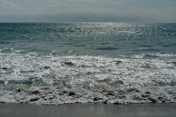 Wave breaking on Los Frailes beach in Machalilla National Park outside of Puerto Lopez, Ecuador