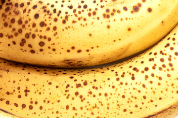 Yellow color, banana texture - micro image. Texture of ripe organic banana closeup