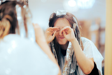 Woman Feeling her Eyes Hurt Being Allergic to Hair Product. Hair salon customer having an allergic reaction to hydrogen peroxide
