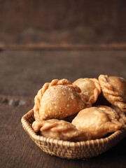deep fried mini curry puff on wooden background