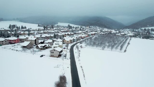 Bacuch small town near high tatra national park on a heavy snow day, aerial view