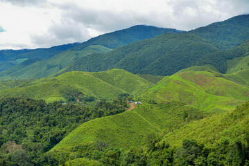 Village in the middle of the valley in the midst of nature during the rainy season. Sapan Village, Nan Thailand