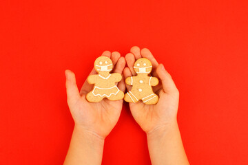 Happy 2023 New Year's set of cookies, gingerbread man, woman in medical face mask from ginger...