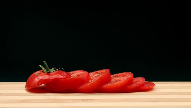 Whirling tomato is chopped. Stop motion animation.