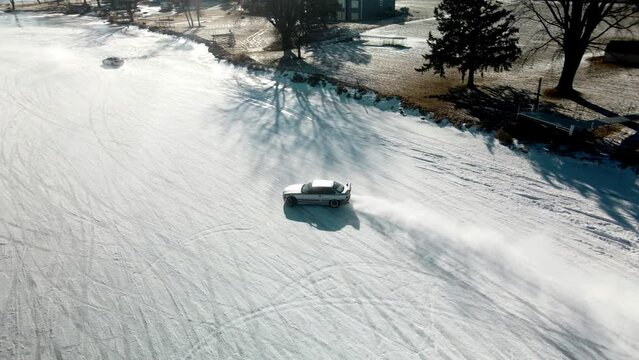 aerial view of bmw drifting on a curbe at the iced track from Poynette Wisconsin