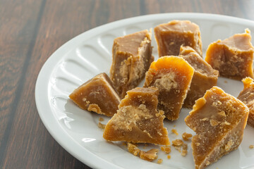 brazilian rapadura, a sweet made of sugarcane, in a white dish