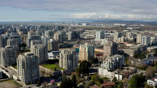 Multi-story Buildings In Downtown Richmond On A Sunny Summer Day In Metro Vancouver, BC, Canada. - aerial