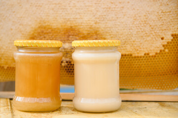 jar of fresh honey in a glass jar. Beekeeping concept. Top view. Copy space.