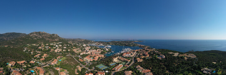 Fototapeta na wymiar Panorama Centre of Costa Smeralda. One of the most expensive resorts in the world. Aerial View of Porto Cervo, Italian seaside resort in northern Sardinia, Italy.