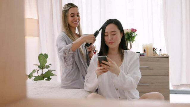 Hair iron, selfie and influencer women in bedroom for friends holiday vacation at a luxury hotel. Friends, people and asian woman taking portrait photography on smartphone to post on social media