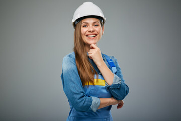 Thinking woman architect or engineer in white safety helmet. Isolated female portrait. - 532357960