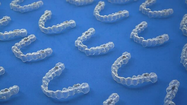 Arranging multiple orthodontic clear aligners for teeth.