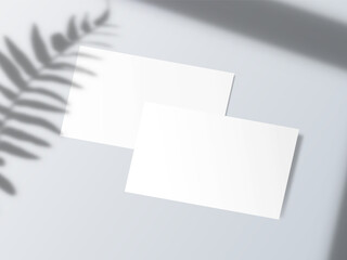 Blank business card with shadow on white background
