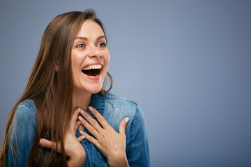 Close up portrait of surprising woman with natural emotion. isolated on blue background.