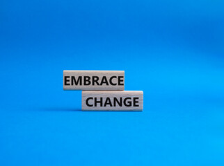 Embrace change symbol. Concept word Embrace change on wooden blocks. Beautiful blue background. Business and Embrace change concept. Copy space