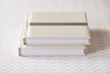 Photo book with leather cover. Stylish wedding or family photo album. Beautiful notepad or photobook with elegant embossing. Printing products. Individual products. Details