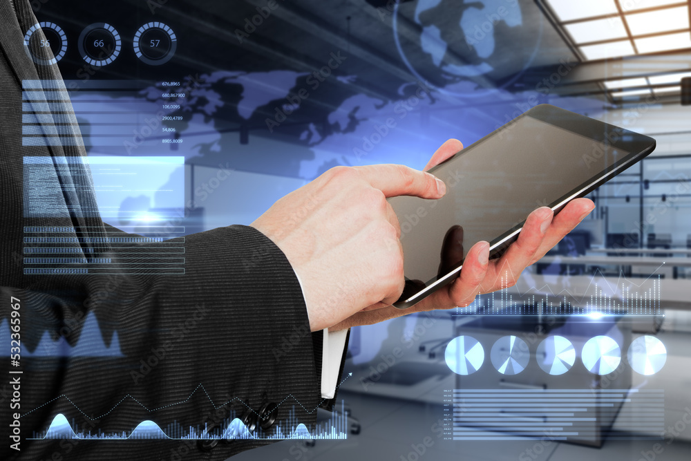 Poster close up of businessman using tablet with abstract glowing holograhic business charts, graphs and ma