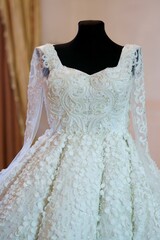 Fototapeta na wymiar Lace and embroidery on fabric with beads wedding dresses