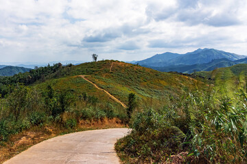 Fototapeta na wymiar Beautiful landscape of Noen Chang Suek (Battle Elephant Hill) mountain view point is Thailand and Myanmar border crossing point. Mountain hill road view point scenic west in Kanchanaburi Thailand.
