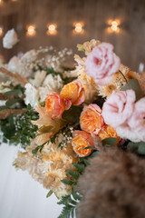 Boho flowers arrangements with fresh and dried flowers, reed, pampas grass and greenery. Wedding flower decorations.