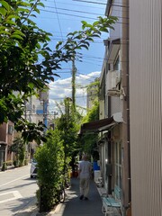 Narrow sidewalk of street in Tokyo downtown “Nezu”, year 2022