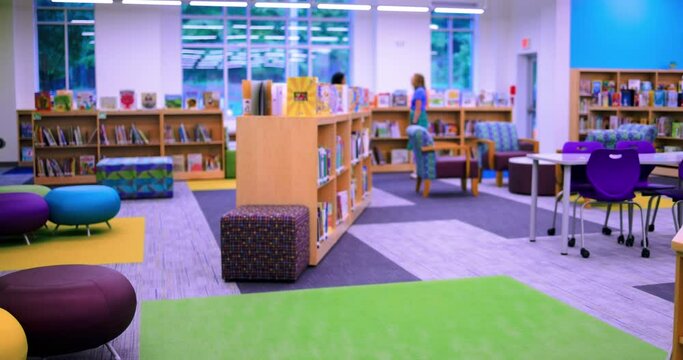 library reading room in elementary school with lots of colorful books on the shelves
