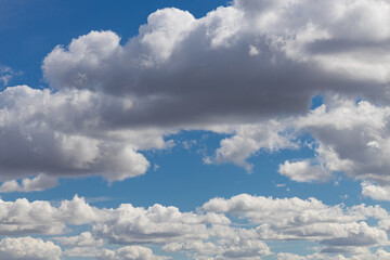 landscape with cumulus clouds in the summer sky