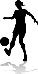 A female soccer football player woman in silhouette