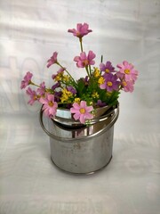 Pink flowers in a stainless vase