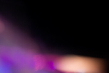Blur colorful rainbow crystal light leaks on black background. Defocused abstract multicolored retro film lens flare bokeh analog photo overlay or screen filter effect. Glow Vintage prism colors