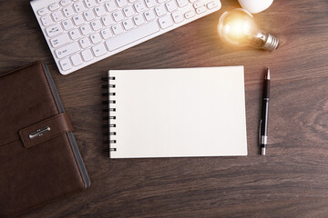 light bulb and computer on working table