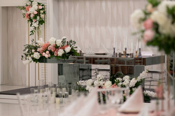 Mirror main table at a wedding reception with beautiful fresh flowers