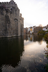 Obraz premium Gravensteen , medieval castle near leie river in old town of ghent dunring winter evening : Ghent , Belgium : November 30 , 2019