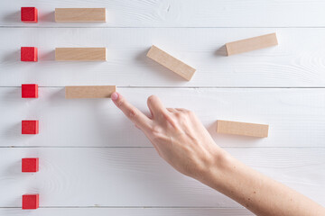 Close up of analyst hands point at charts on board. Concept of analytical data