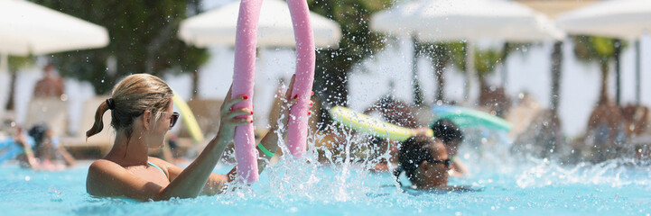 Group of women in pool doing water aerobics