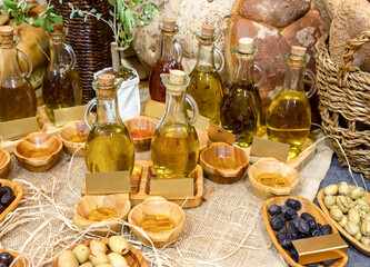 olive oil and olives on the counter, top view