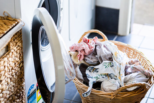Basket of clean washed washing in laundry ready to be hung up to dry