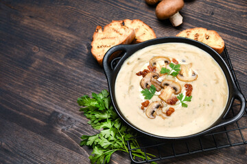 Mushroom soup with bread and fresh mushrooms, autumn seasonal cream soup with vegetables