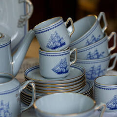 Antique British blue porcelain tea set.wedding table setting is richly decorated in luxurious interior. porcelain vintage service