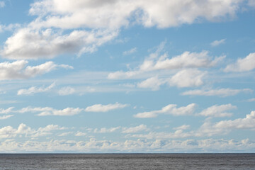 Ocean Horizon and Blue Sky with Clouds Copy Space	