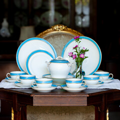 Antique British blue porcelain tea set. wedding table setting is richly decorated in luxurious interior. porcelain vintage service